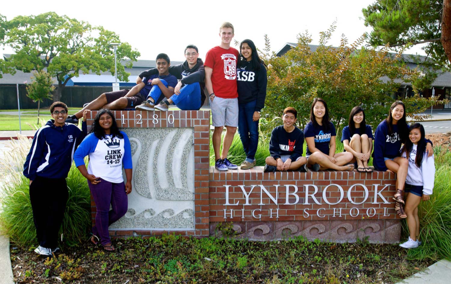 Lynbrook High School students posing at school sign